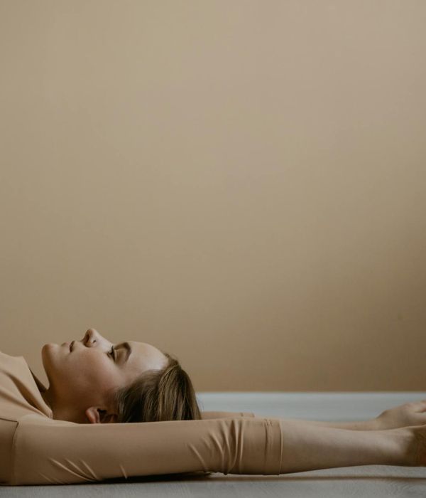 Woman in a flexible yoga pose, demonstrating a stretching asana.